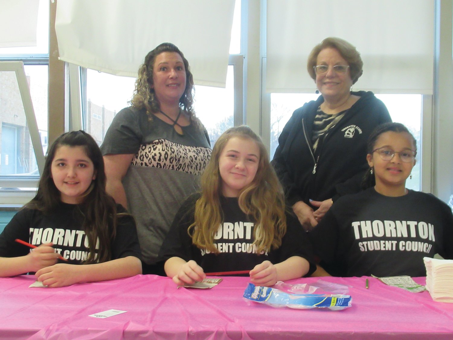 BINGO LEADERS: Thornton Elementary School Student Council members Julianna Stonis, Brooke Charpentier and Sokhna Fall are joined by parent volunteer Dana Stonis and Principal Louise Denham at last Friday’s Bingo Night.